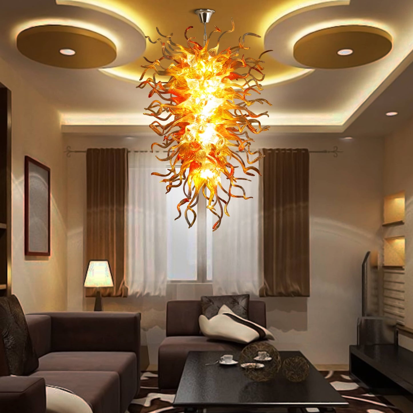 Modern living room featuring a vibrant amber hand blown glass chandelier as a unique, artistic light source above the seating area.