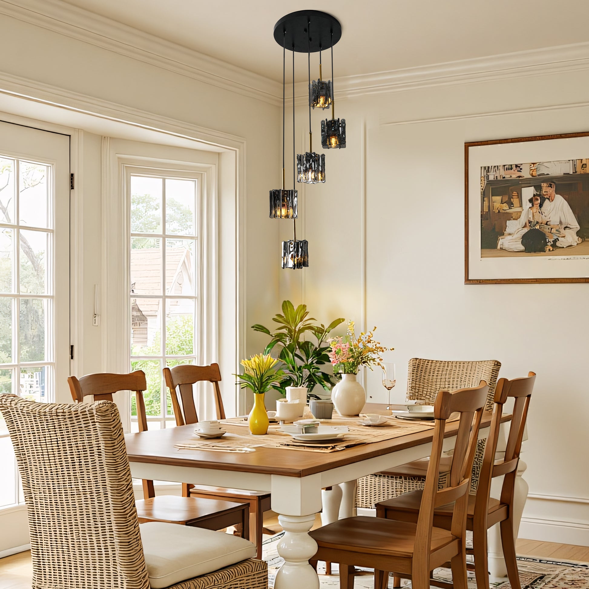 Modern 5-light cluster chandelier with smoke gray textured glass above a dining table with wicker chairs