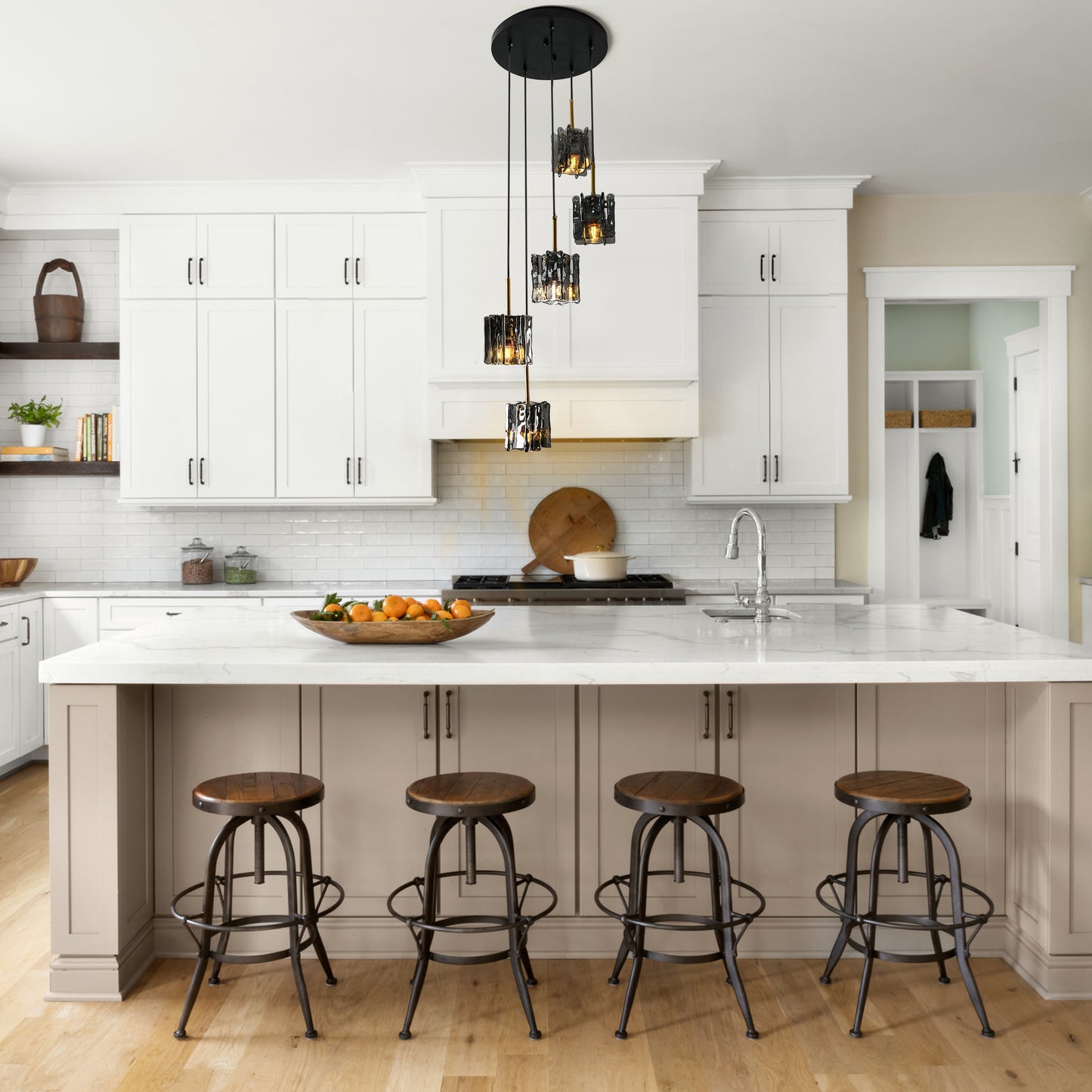 Modern 5-light cluster chandelier with smoke gray textured glass above a white kitchen island