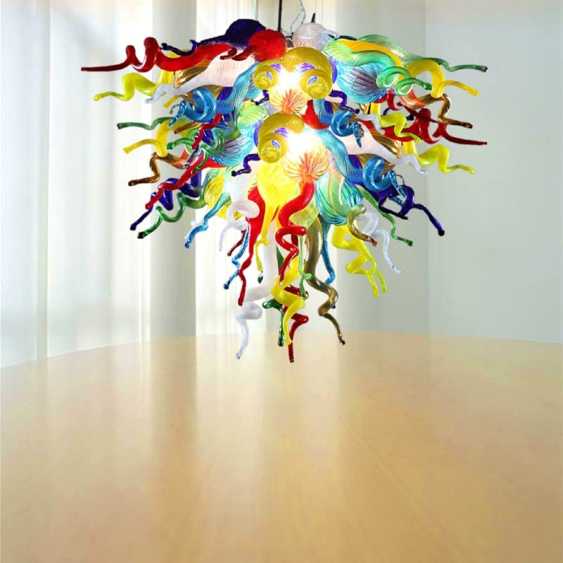 Hand blown art glass chandelier in a brightly lit room, demonstrating its radiant glow above a clean surface.