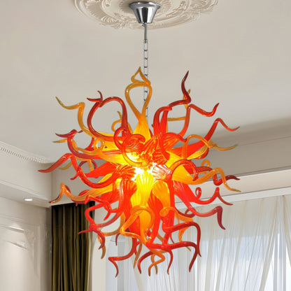 Fiery Chihuly-style hand blown art glass chandelier in bright space.