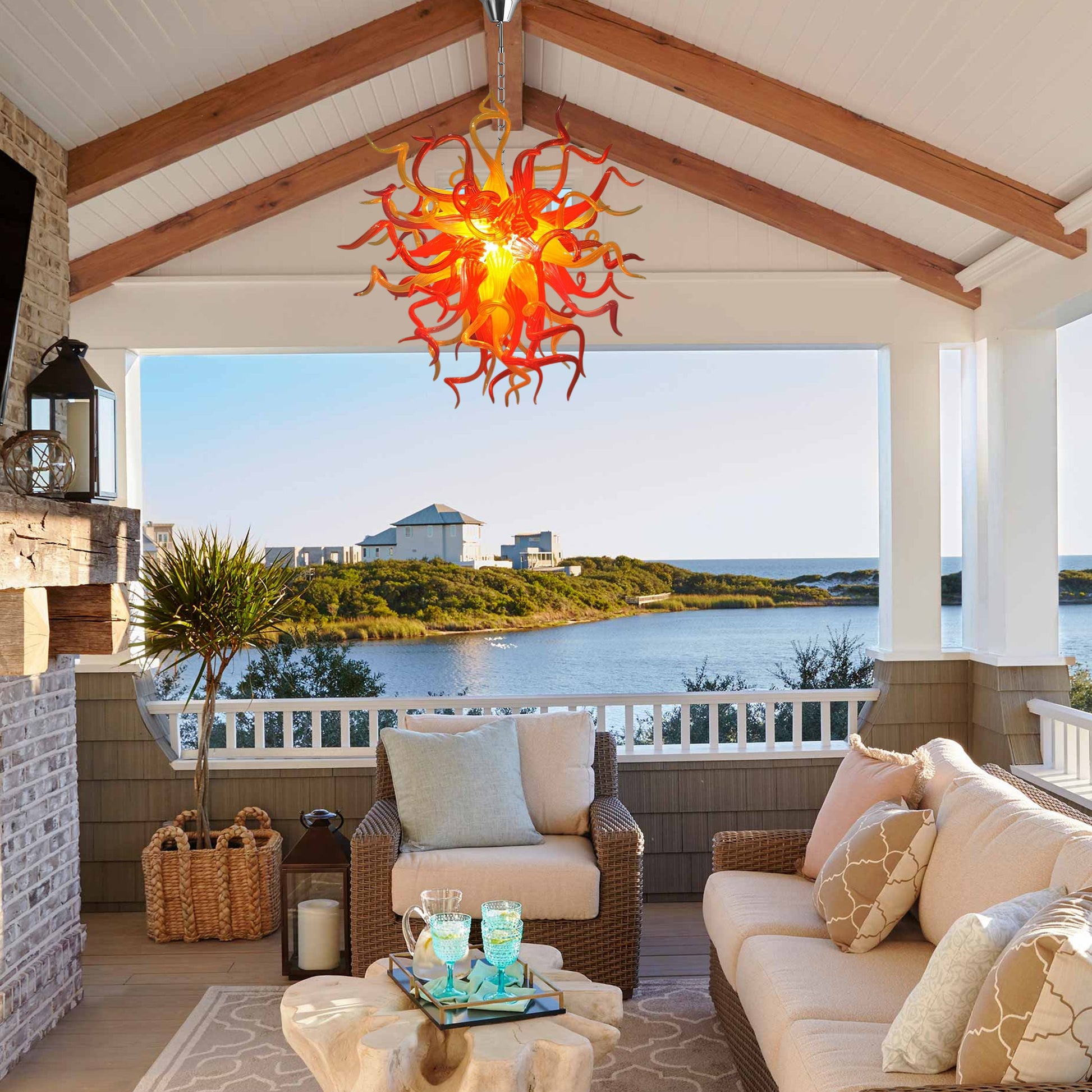 Blazing Sunset Chihuly style hand blown art glass chandelier in a Mediterranean-style living room.