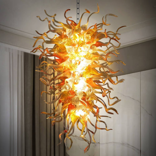 Artistic close-up of the glass overlapping, creating depth and a captivating interplay of light and shadow within the hand blown glass chandelier.