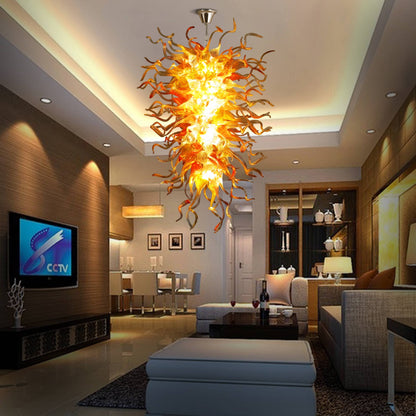 Image focusing on the central cluster of the hand blown glass chandelier, where the light source illuminates the dense glass elements.