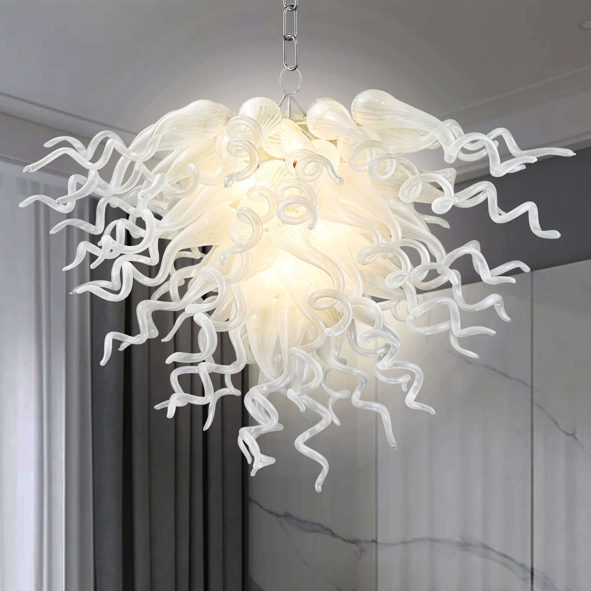 Hand-blown glass art chandelier in white, perfectly integrated into a sophisticated modern home environment.