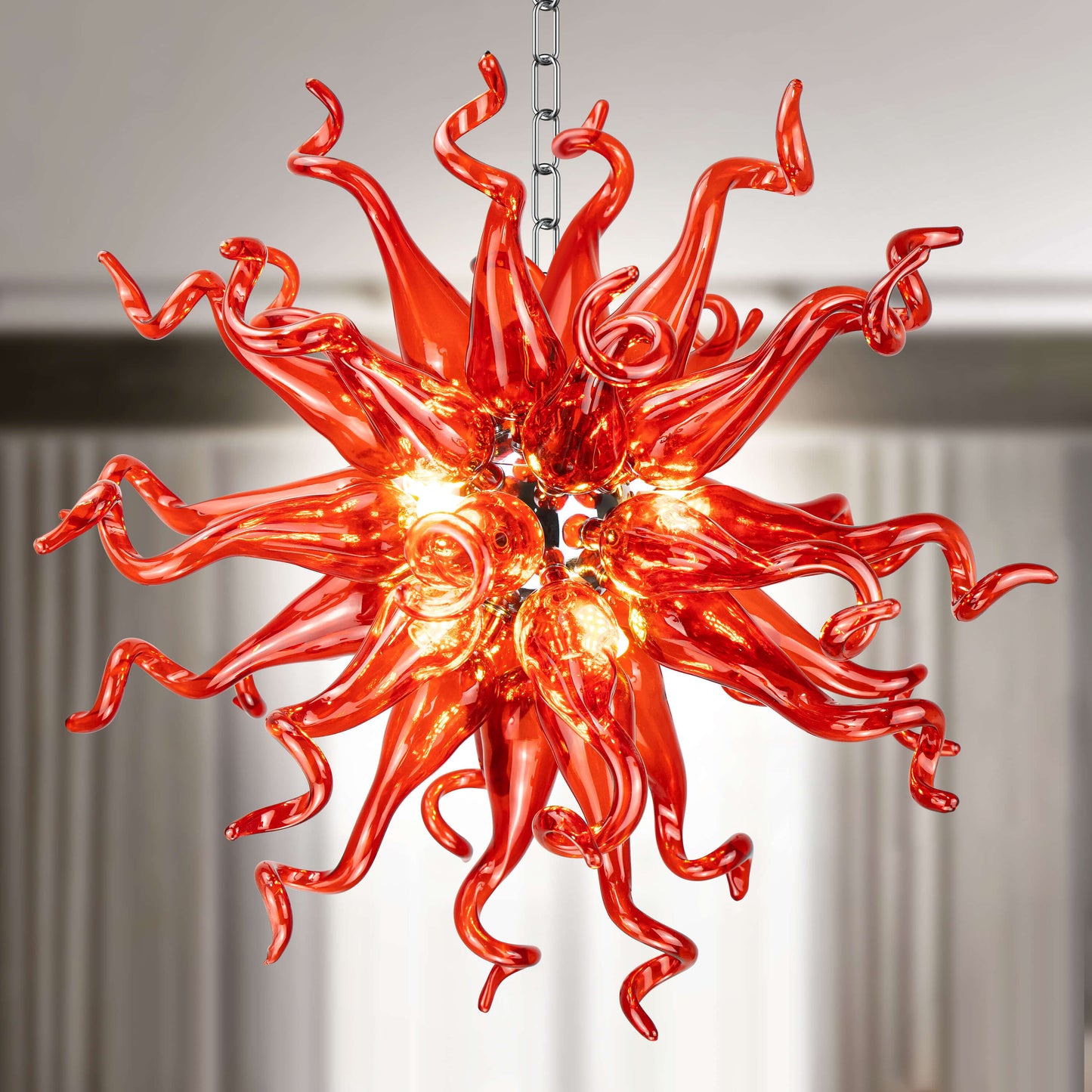 Close-up of a unique blown glass art chandelier crafted from vibrant red hand blown glass elements.