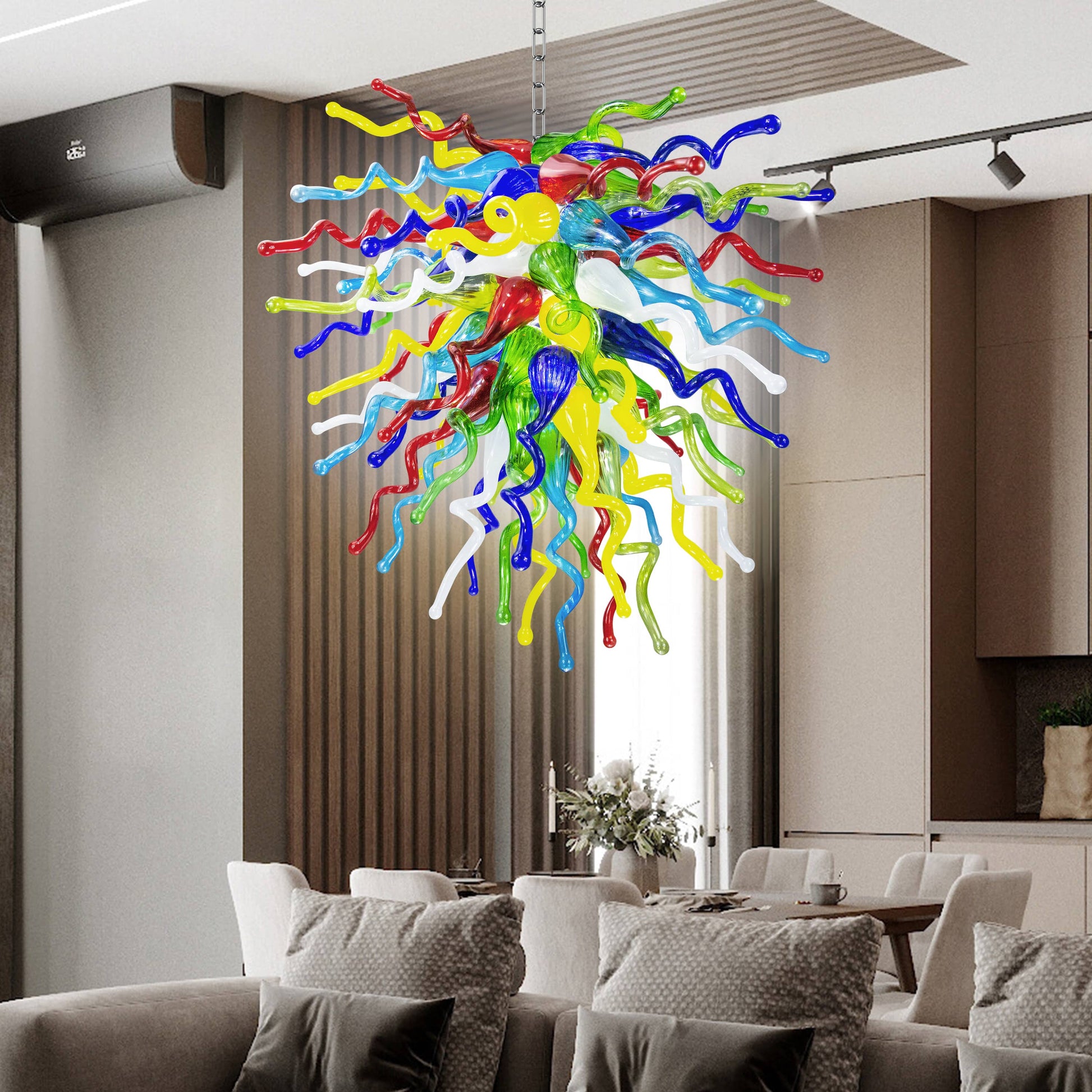 Chihuly-style multi-color hand blown glass chandelier creating a cheerful focal point in a stylish living room.