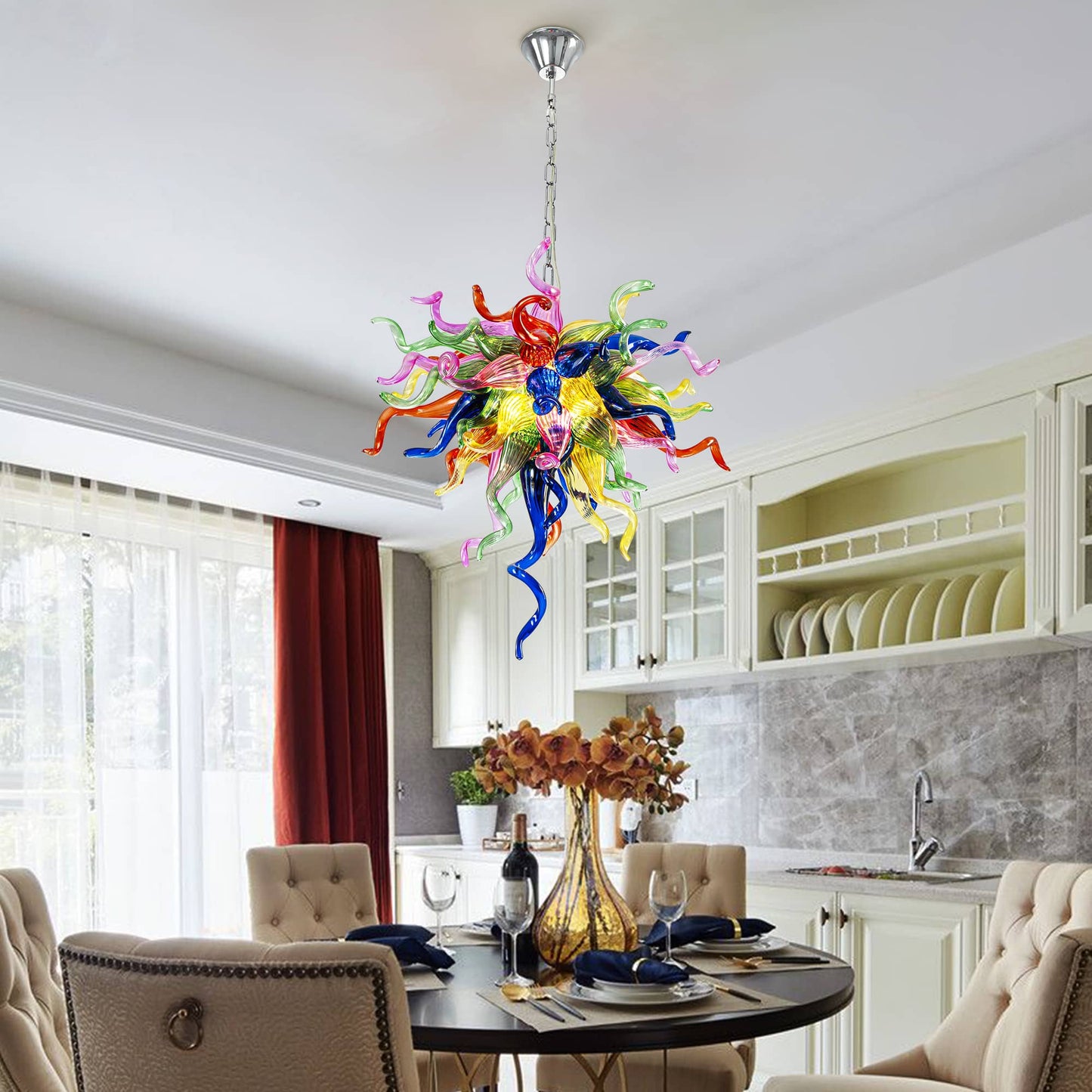 Colorful blown glass chandelier as the centerpiece of a contemporary dining area.