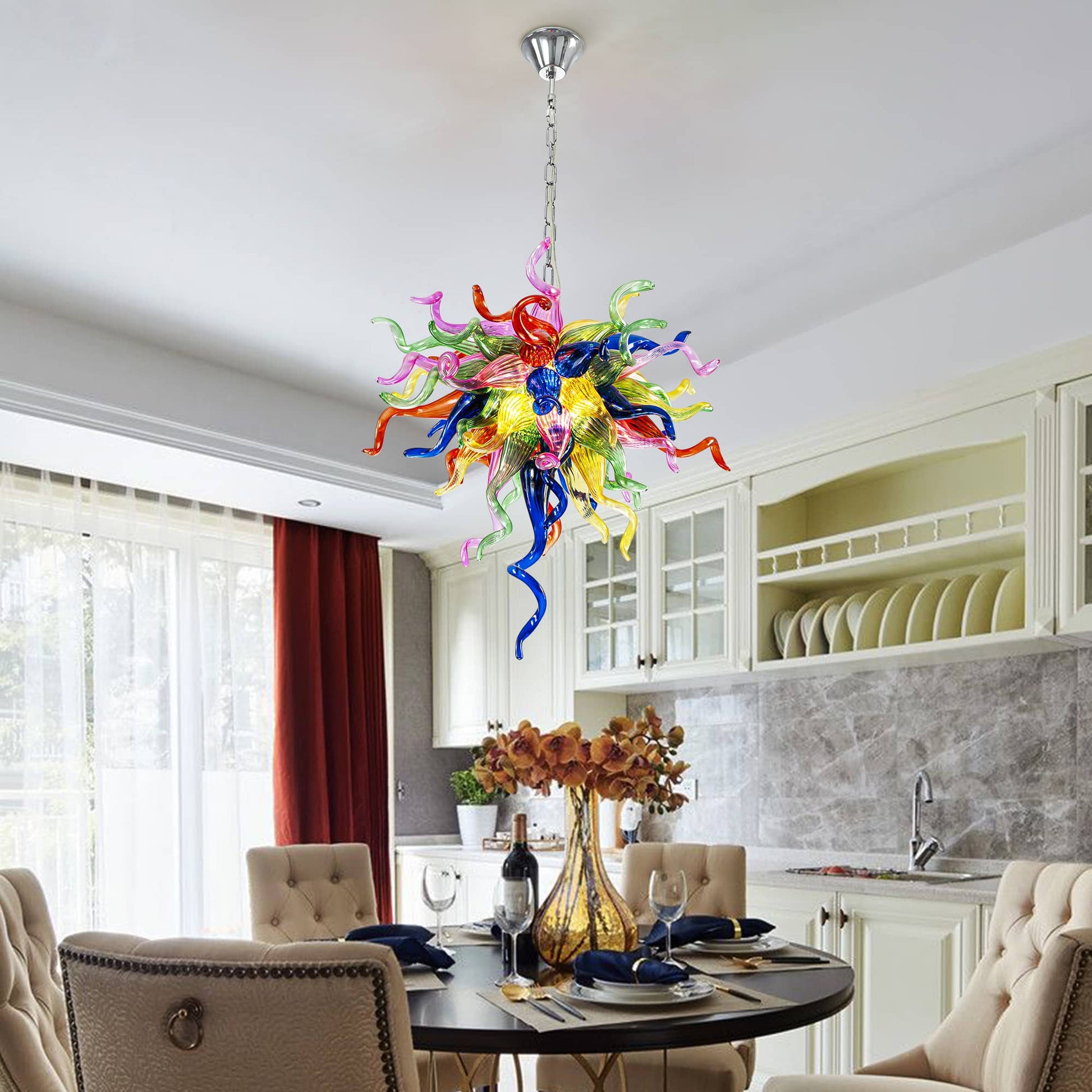 Colorful blown glass chandelier as the centerpiece of a contemporary dining area.