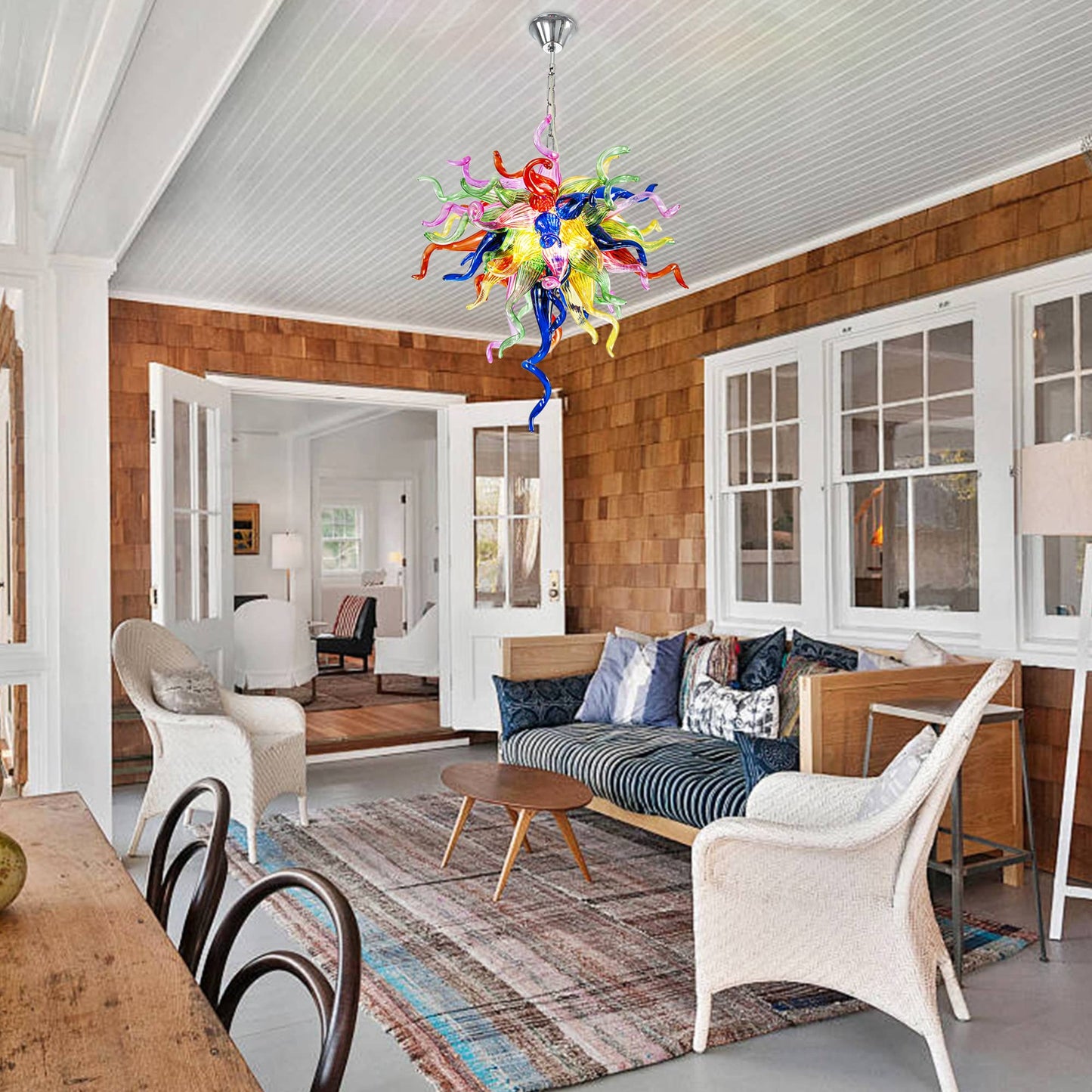 Vibrant hand-blown glass chandelier with multicolor tendrils hanging in a modern interior.