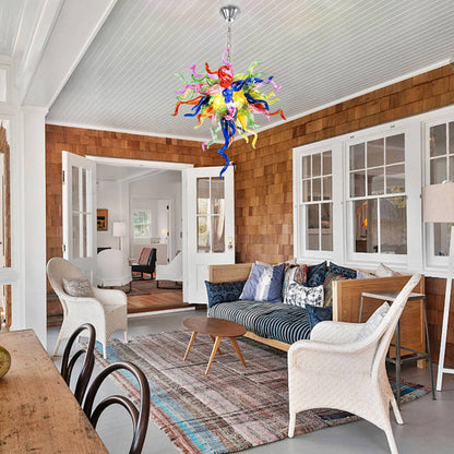 Vibrant hand-blown glass chandelier with multicolor tendrils hanging in a modern interior.