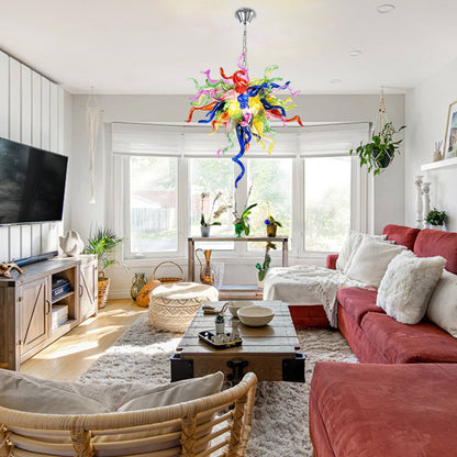 Modern blown glass chandelier featuring a dazzling array of red, blue, green, and yellow blown glass.