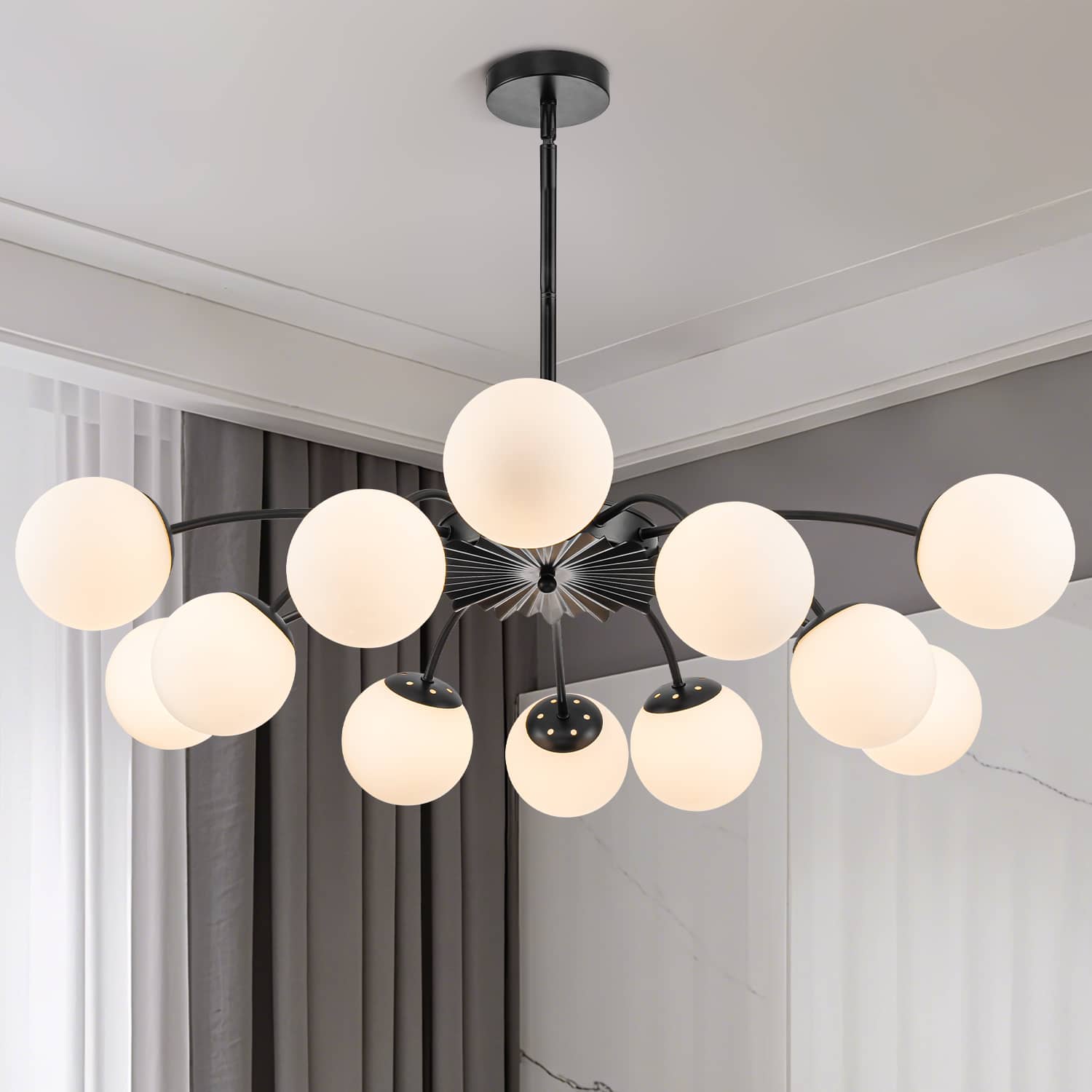 Black bubble globe chandelier with 12 frosted white opal glass shades in modern room.