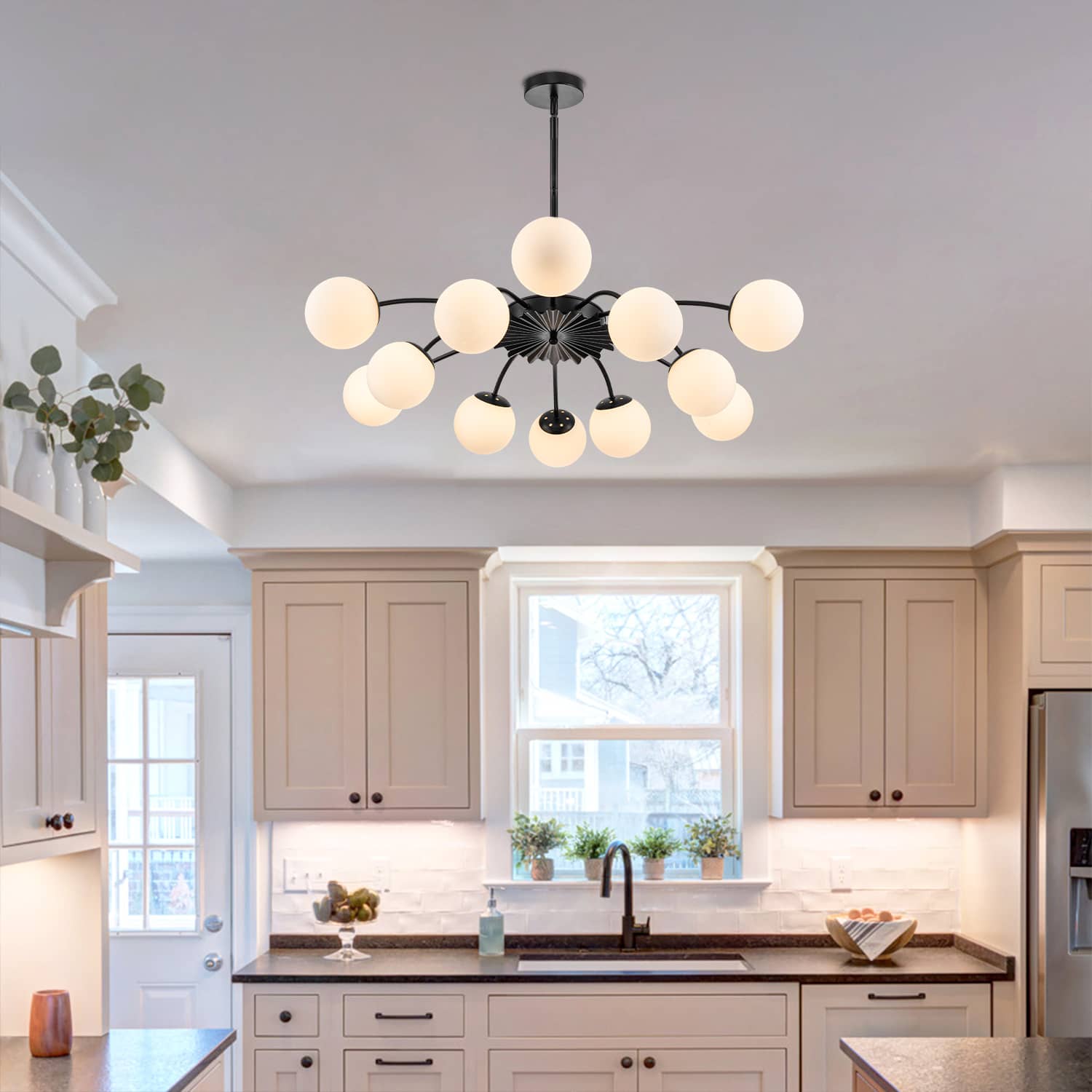 Black 12-light frosted glass bubble globe chandelier in contemporary kitchen with open shelving decor.