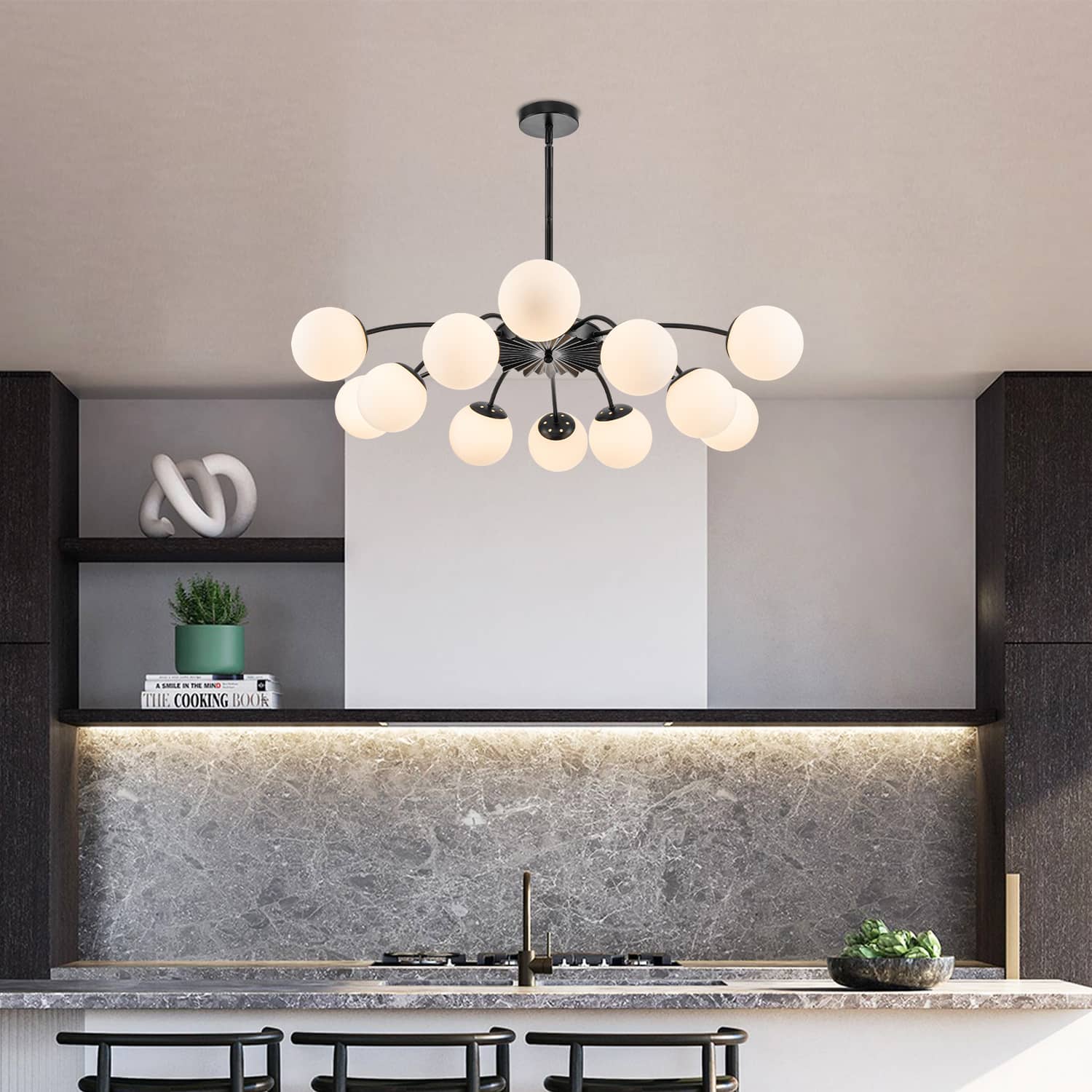 12-Light frosted glass pendant black bubble globe chandelier in modern kitchen with marble backsplash.