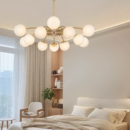 12-Light frosted glass pendant bubble globe chandelier over a contemporary bedroom.