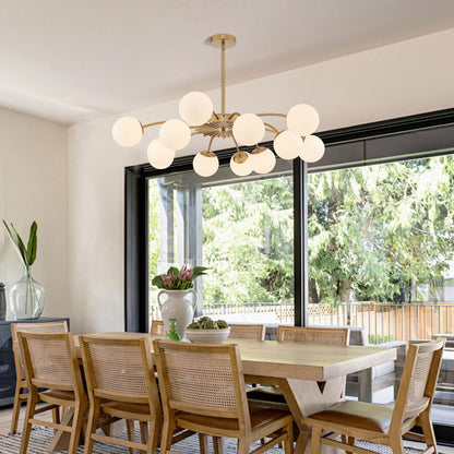 12-Light frosted glass pendant hanging globe chandelier over a large wooden dining table.