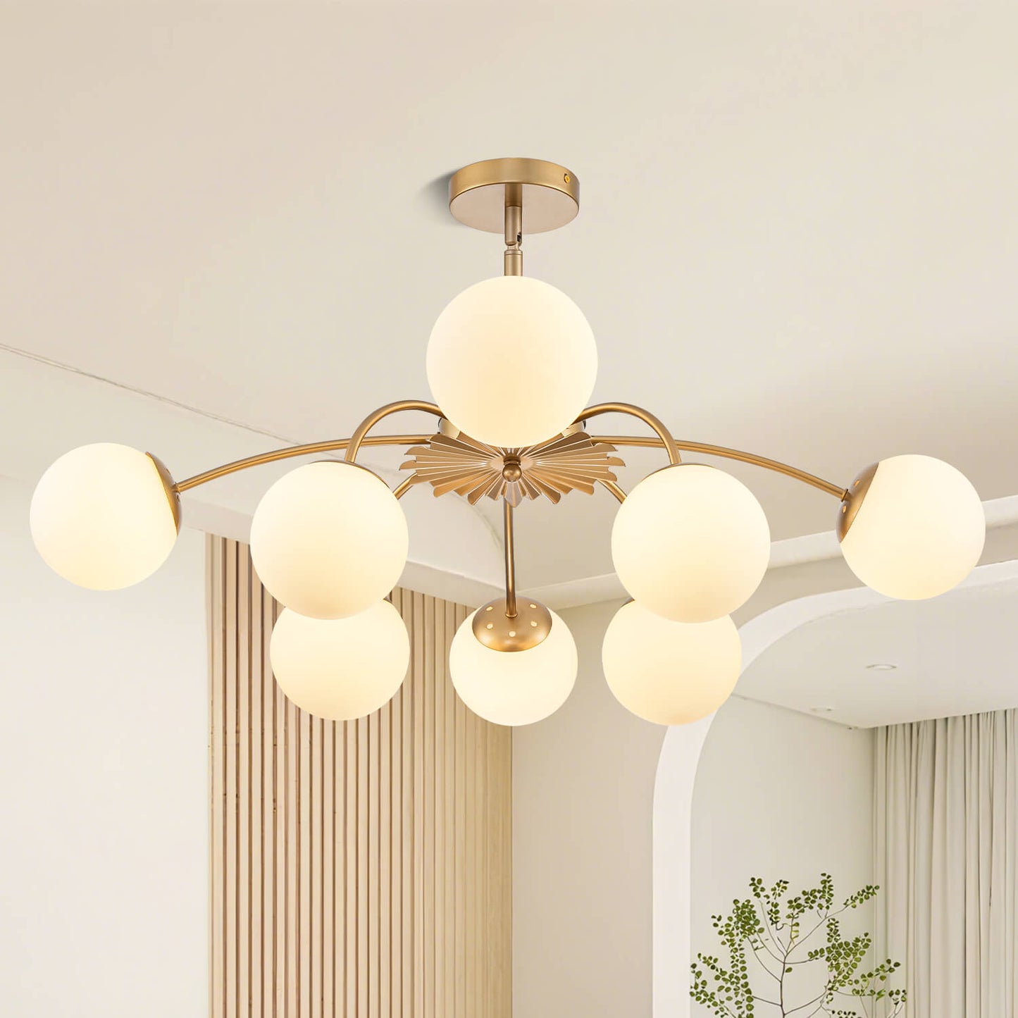 Gold 8-light frosted glass bubble globe chandelier in modern living room.