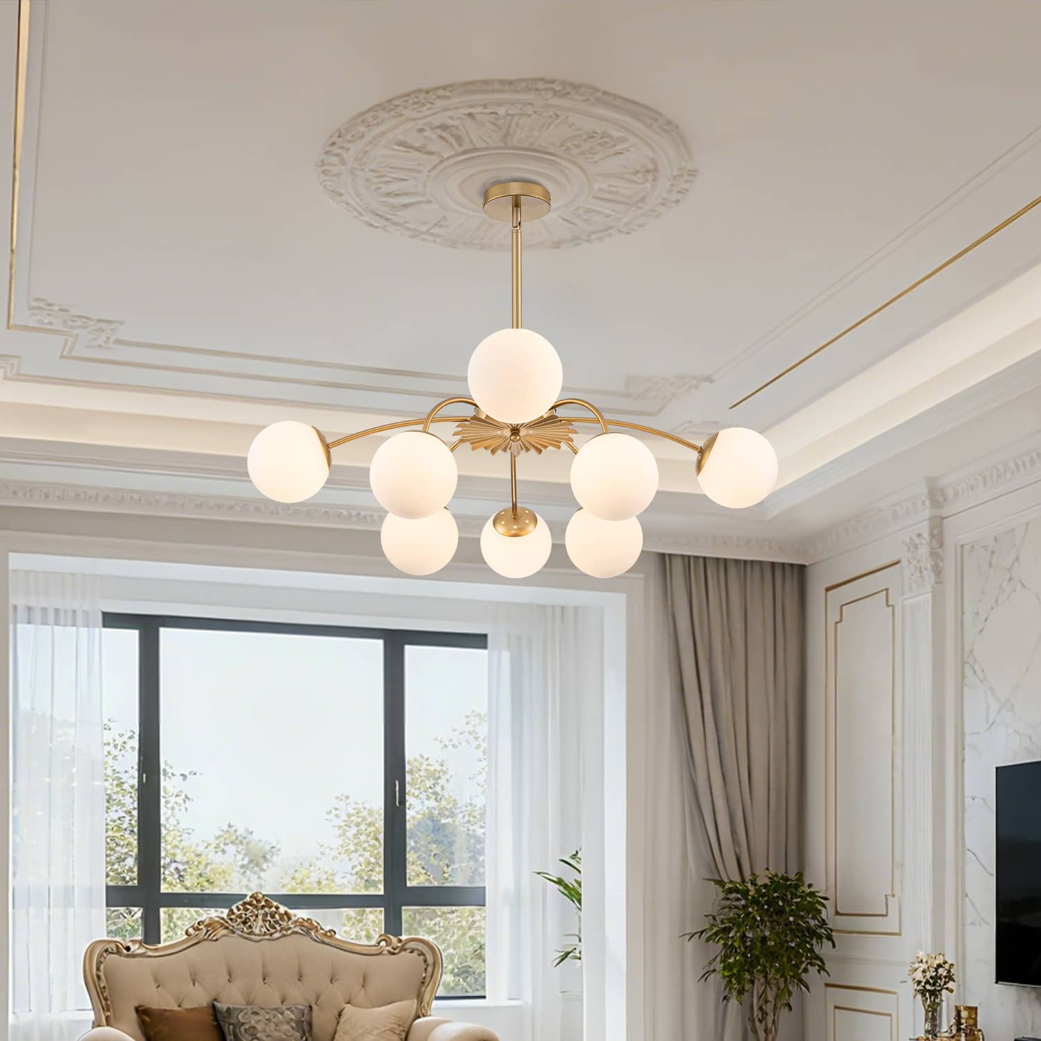 Elegant 8-light frosted glass bubble globe chandelier installed over a luxury living room area.