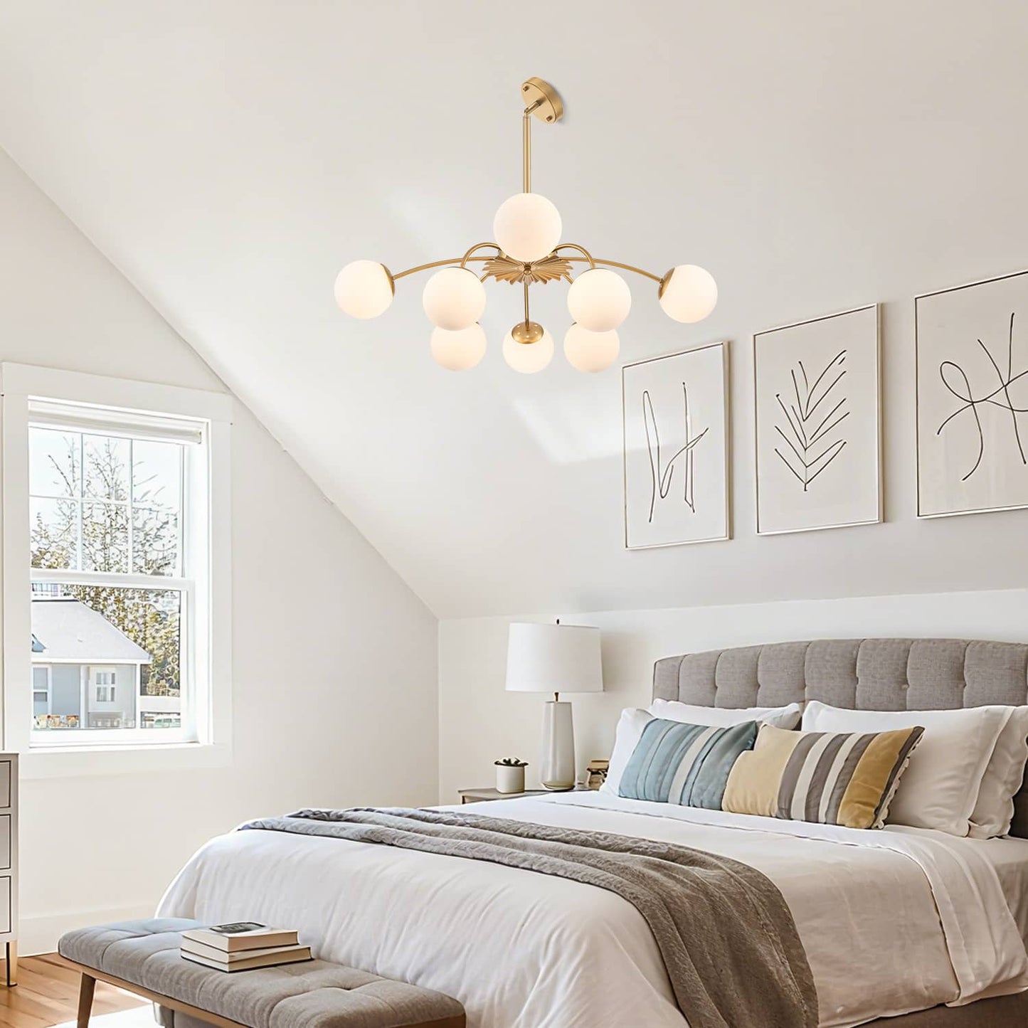 Demonstrating the frosted glass bubble Hanging Globe chandelier mounted on a slanted ceiling in a bedroom.