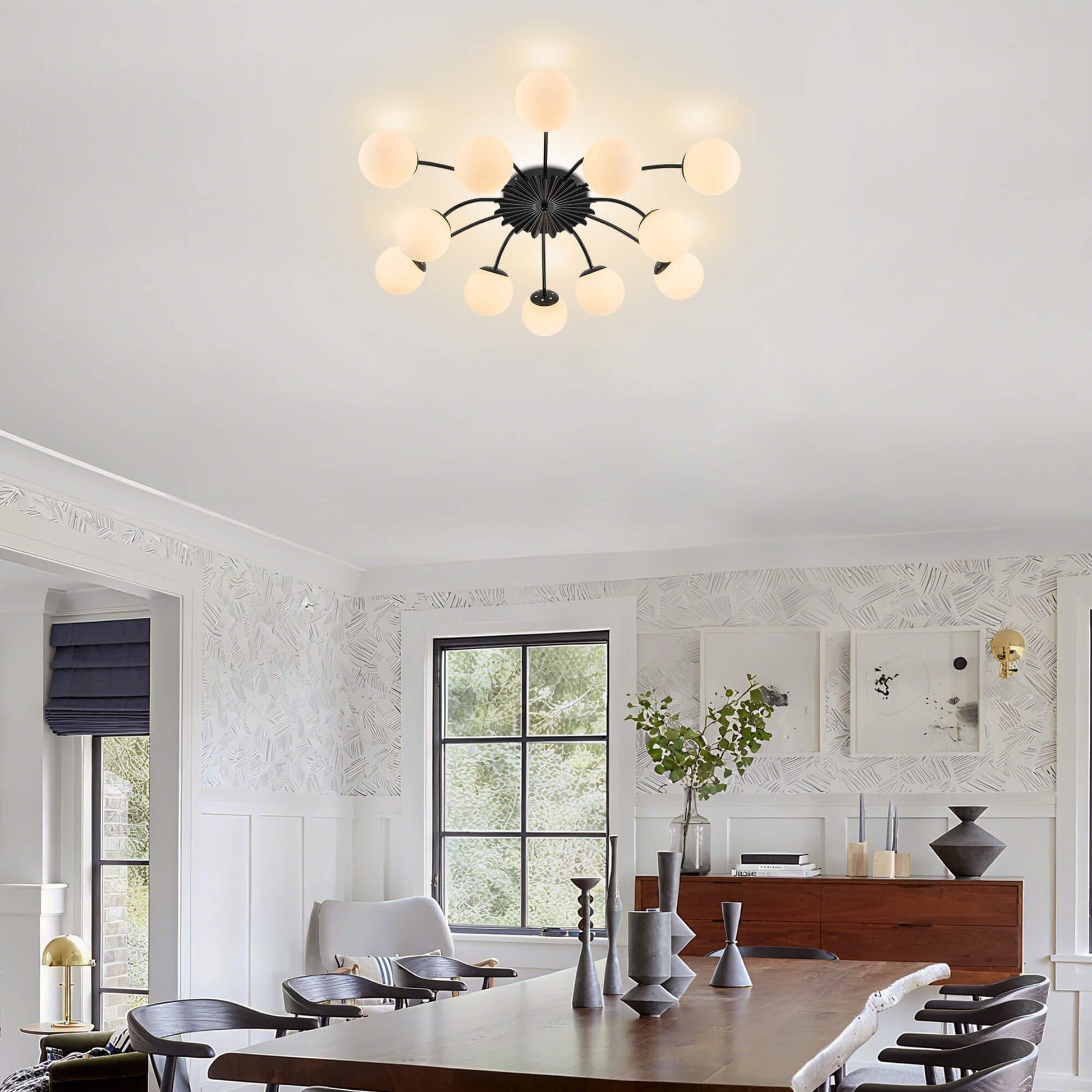 Contemporary 12-light black frosted globe ceiling light in open-concept kitchen and dining space.