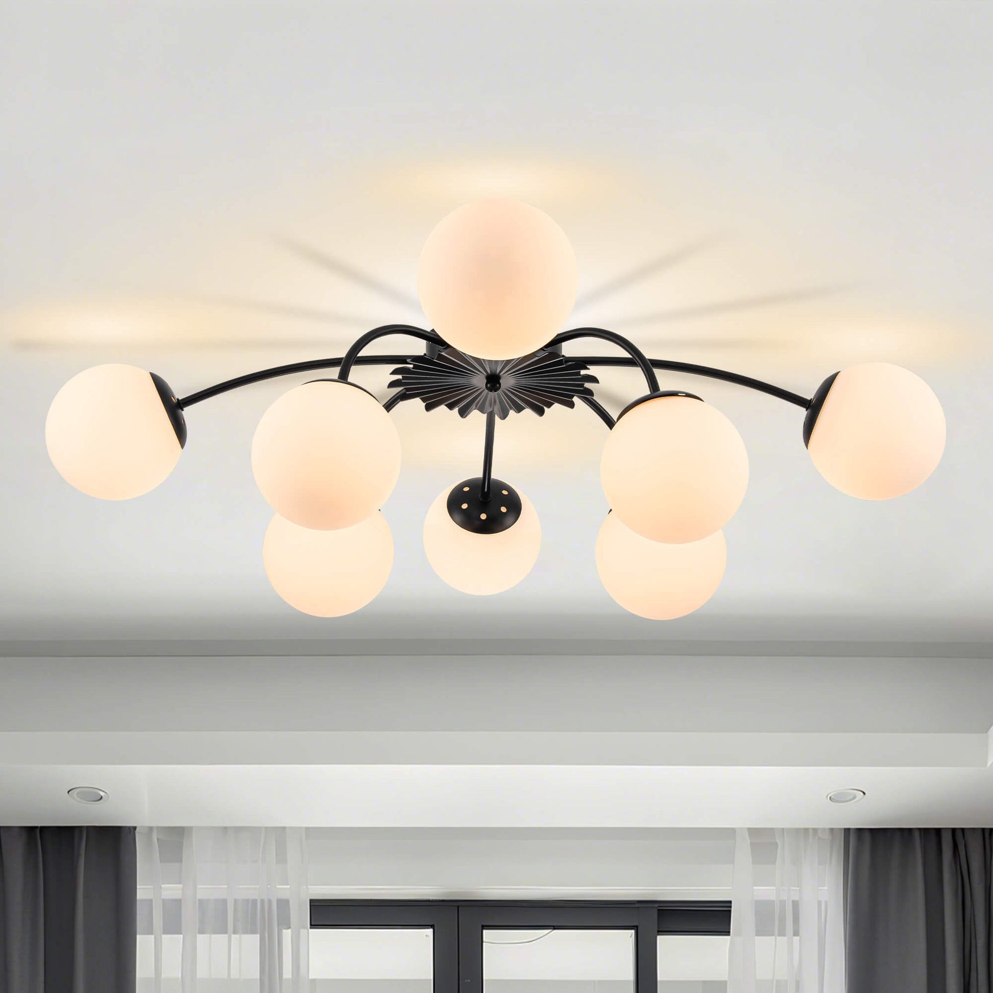 Contemporary black 8-light globe semi-flush mount ceiling light in airy living room.