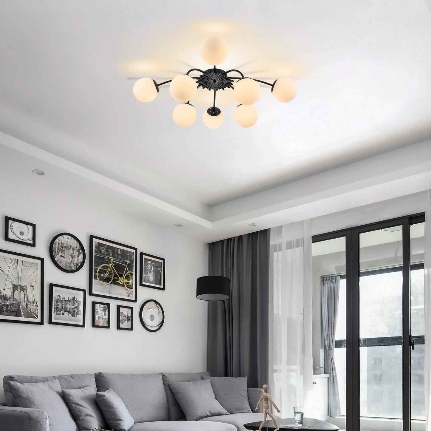 8-Light black ball semi-flush mount ceiling light in modern living room with dark curtains.