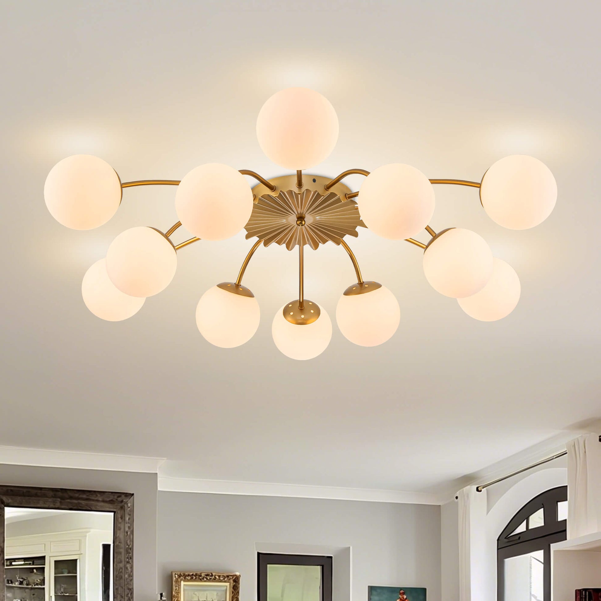 Close-up of the 12-light gold globe semi-flush mount ceiling light on a white ceiling, highlighting the brushed gold finish.