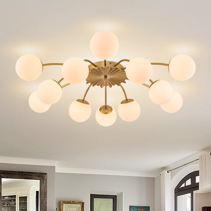 Close-up of the 12-light gold globe semi-flush mount ceiling light on a white ceiling, highlighting the brushed gold finish.