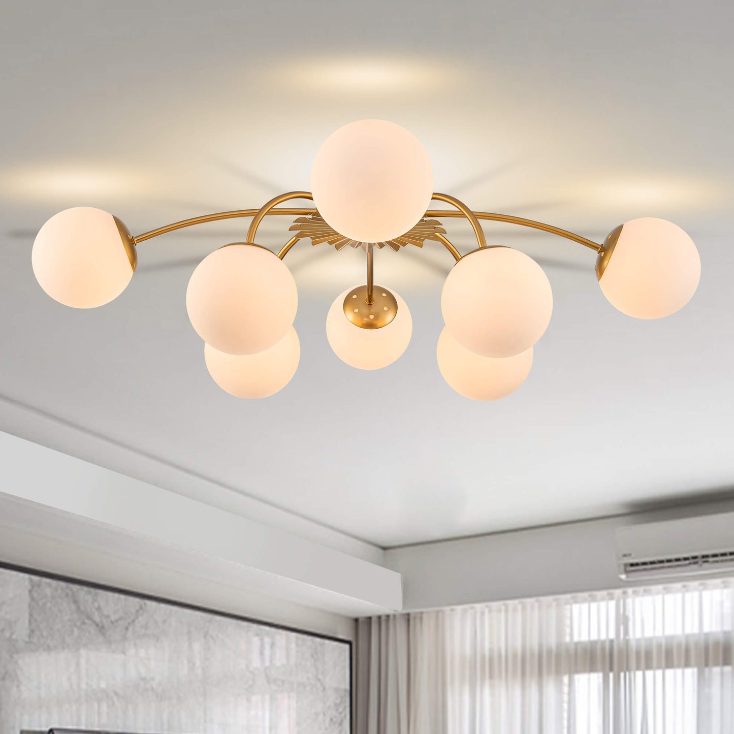 8-Light modern bubble gold ceiling light with frosted globes.
