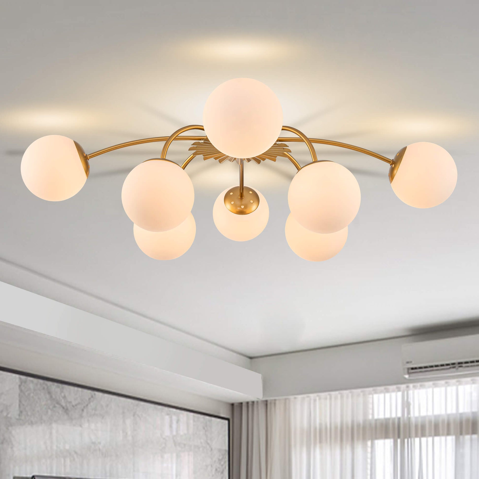 8-Light modern bubble gold ceiling light with frosted globes.