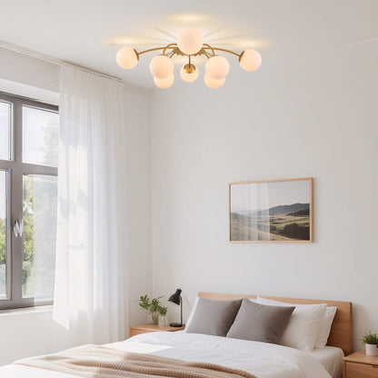8-Light frosted bubble gold globe semi-flush mount ceiling light in bright bedroom.