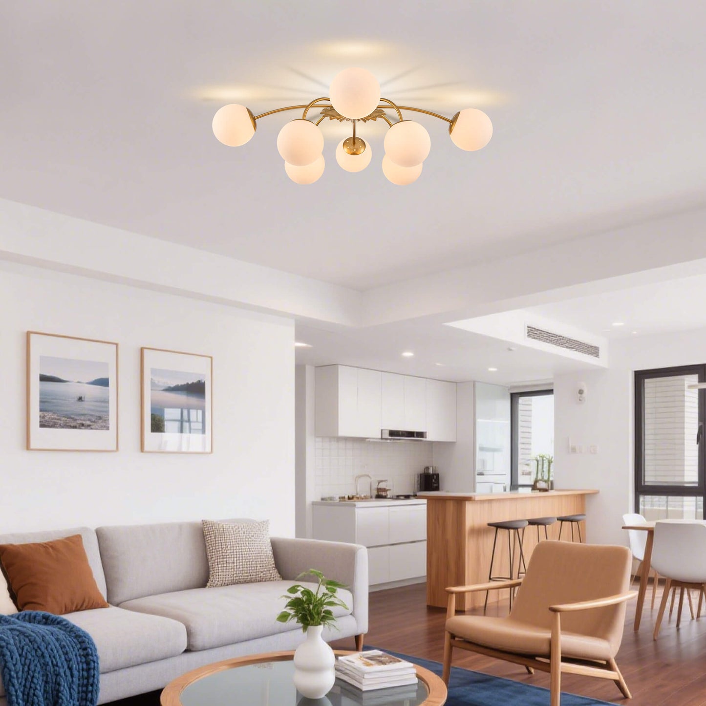 Gold 8-light frosted globe semi-flush mount ceiling light illuminating an open-concept living space.