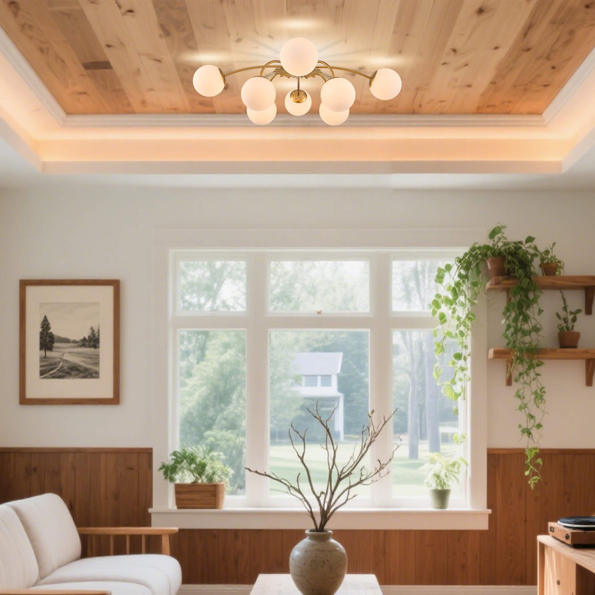 Modern bubble gold globe ceiling light installed in bright living room.