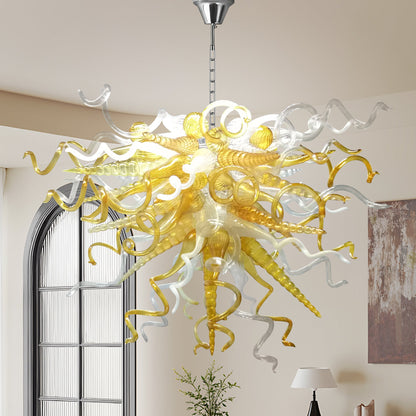 Amber and clear blown murano glass chandelier hanging a modern high-ceiling.