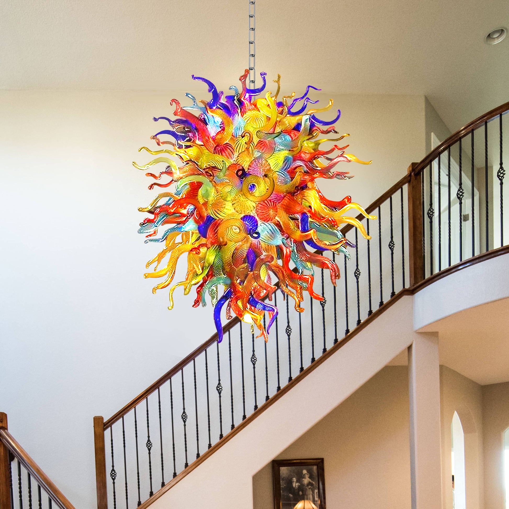Colorful glass chandelier in Chihuly type hanging in a staircase