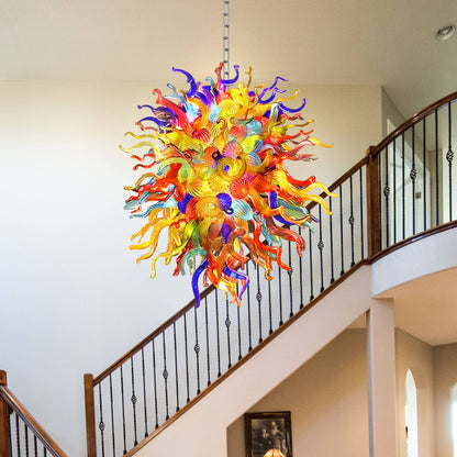 Colorful glass chandelier in Chihuly type hanging in a staircase