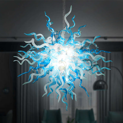 Chihuly chandelier with blue and white  blown glass design in a dark room