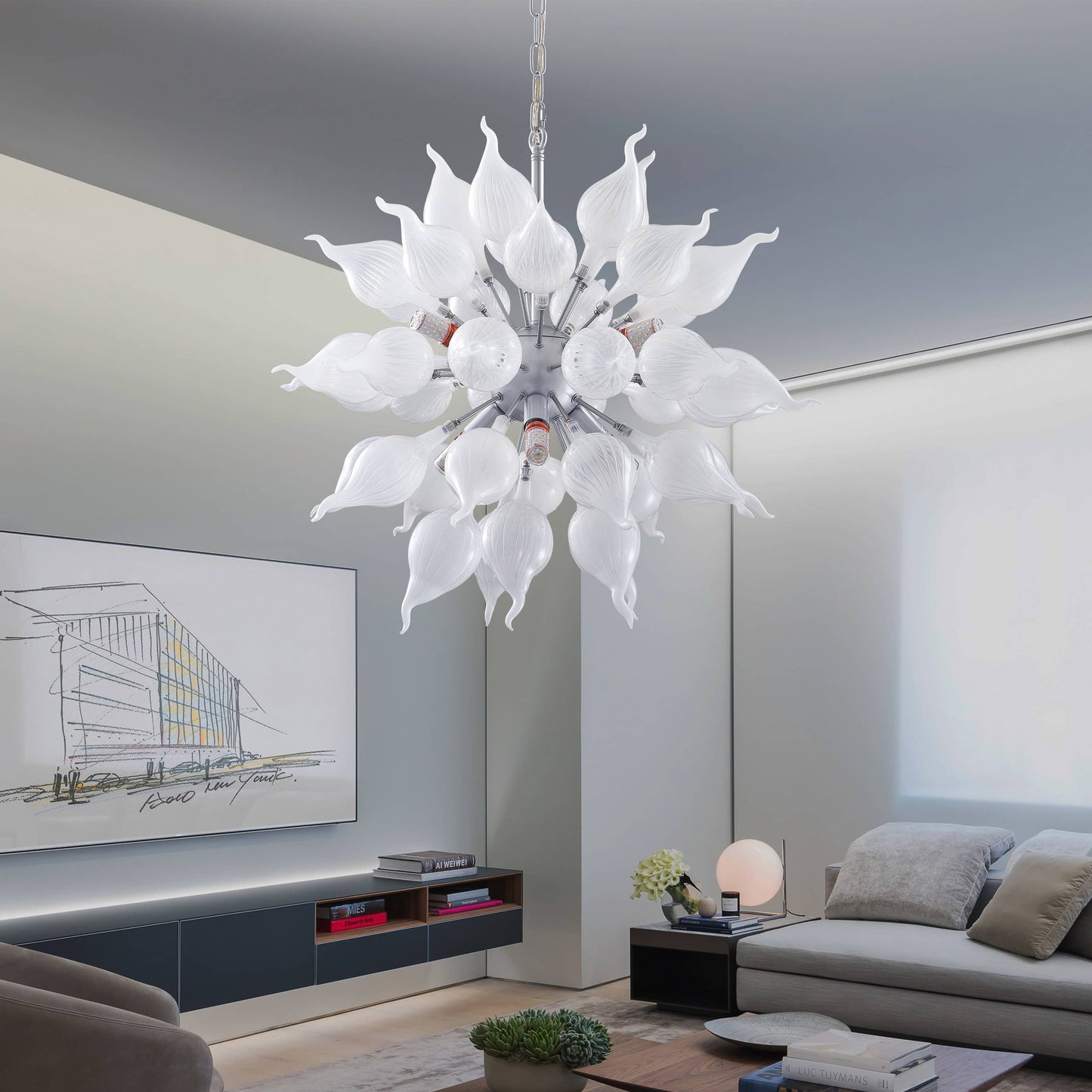 Modern chandelier hanging in a living room with a sofa and TV as an art deco