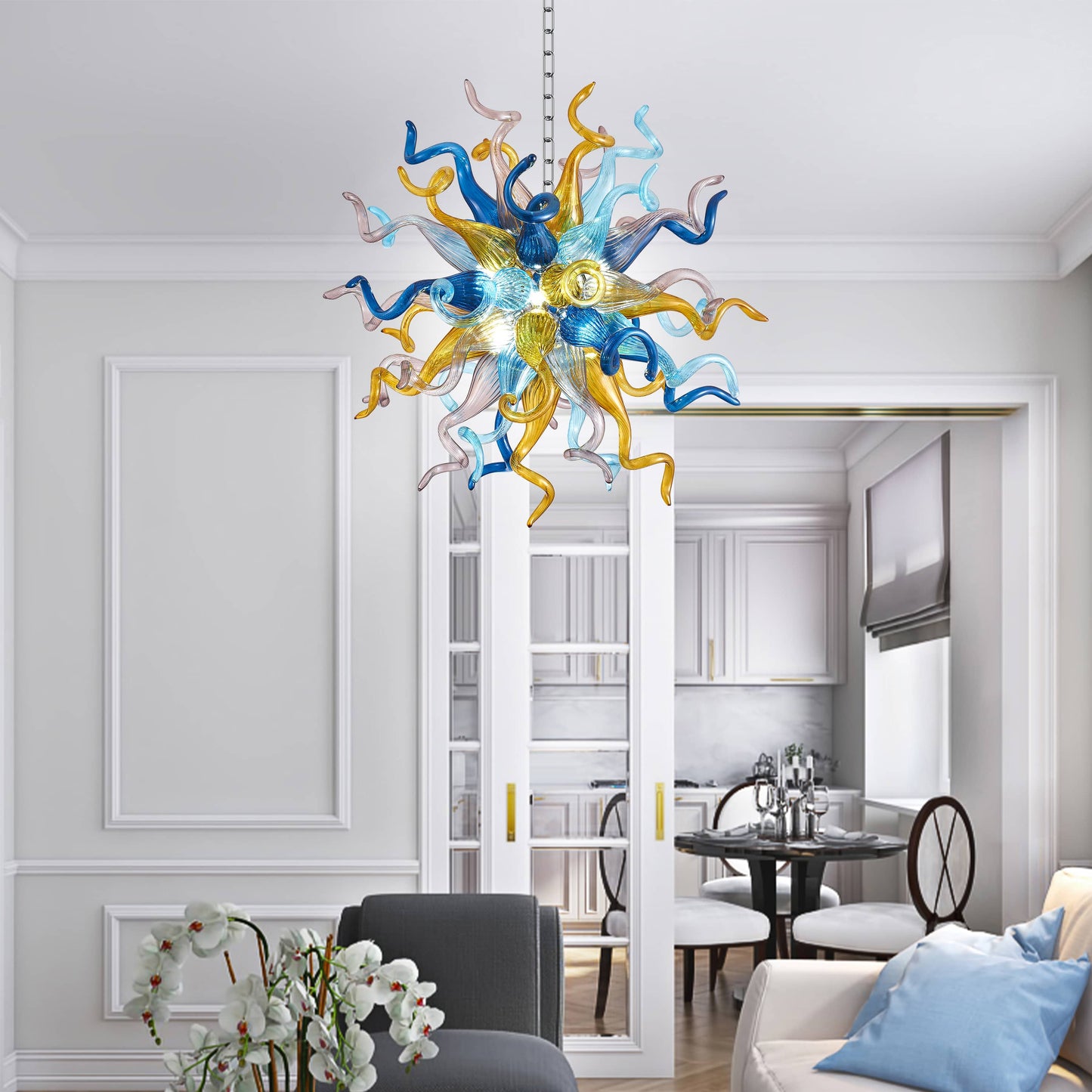 Colorful Chihuly blown glass chandelier in a modern living room with a dining area in the background.