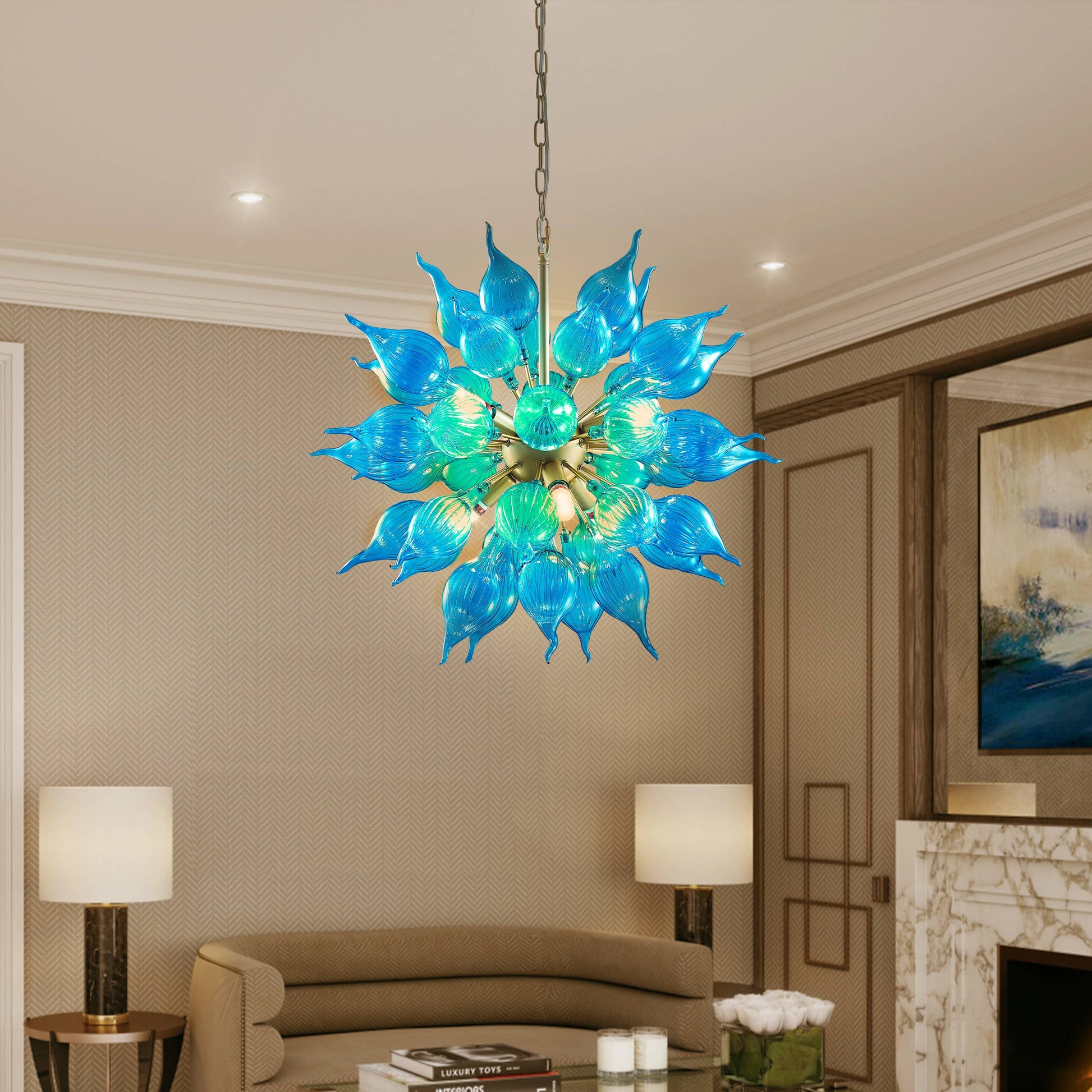 Blue sputnik blown glass chandelier hanging in a living room with beige walls and a couch.