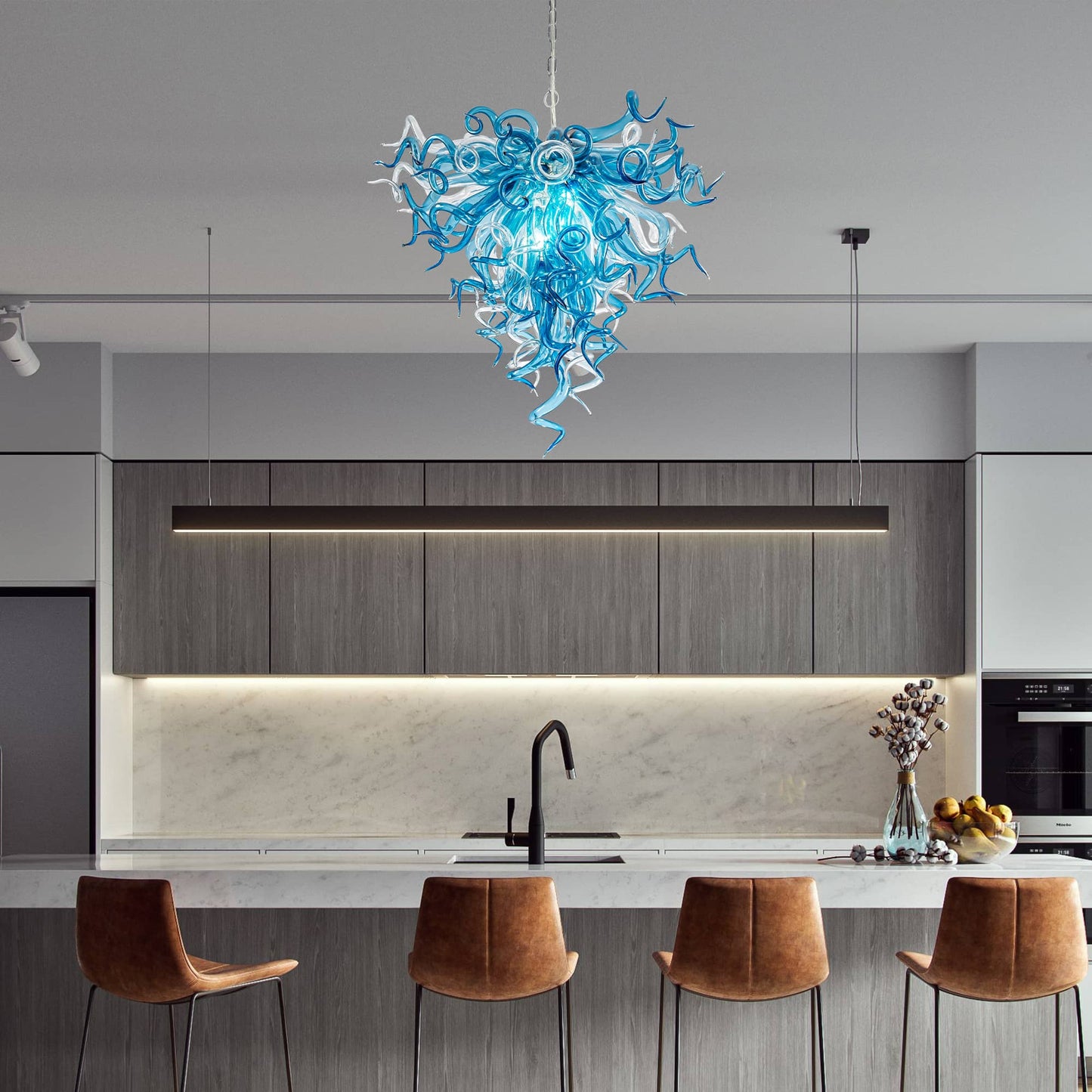 Modern kitchen with a blue and white chandelier, brown stools, and a marble countertop.
