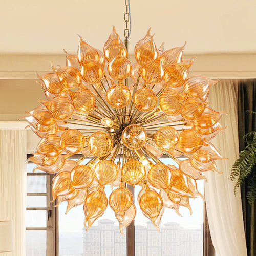 Ornate chandelier with orange glass shades in a room with curtains and a window.