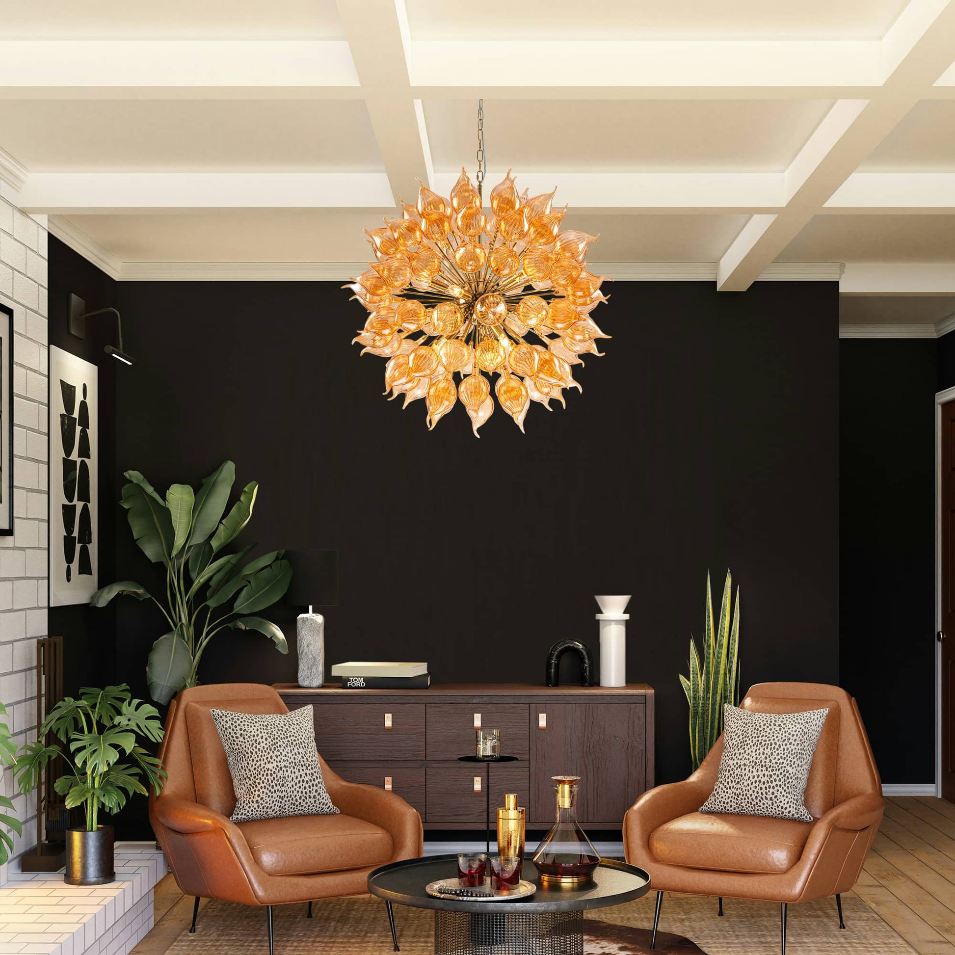 Modern living room with a blown glass  chandelier, brown leather chairs, and decorative items.