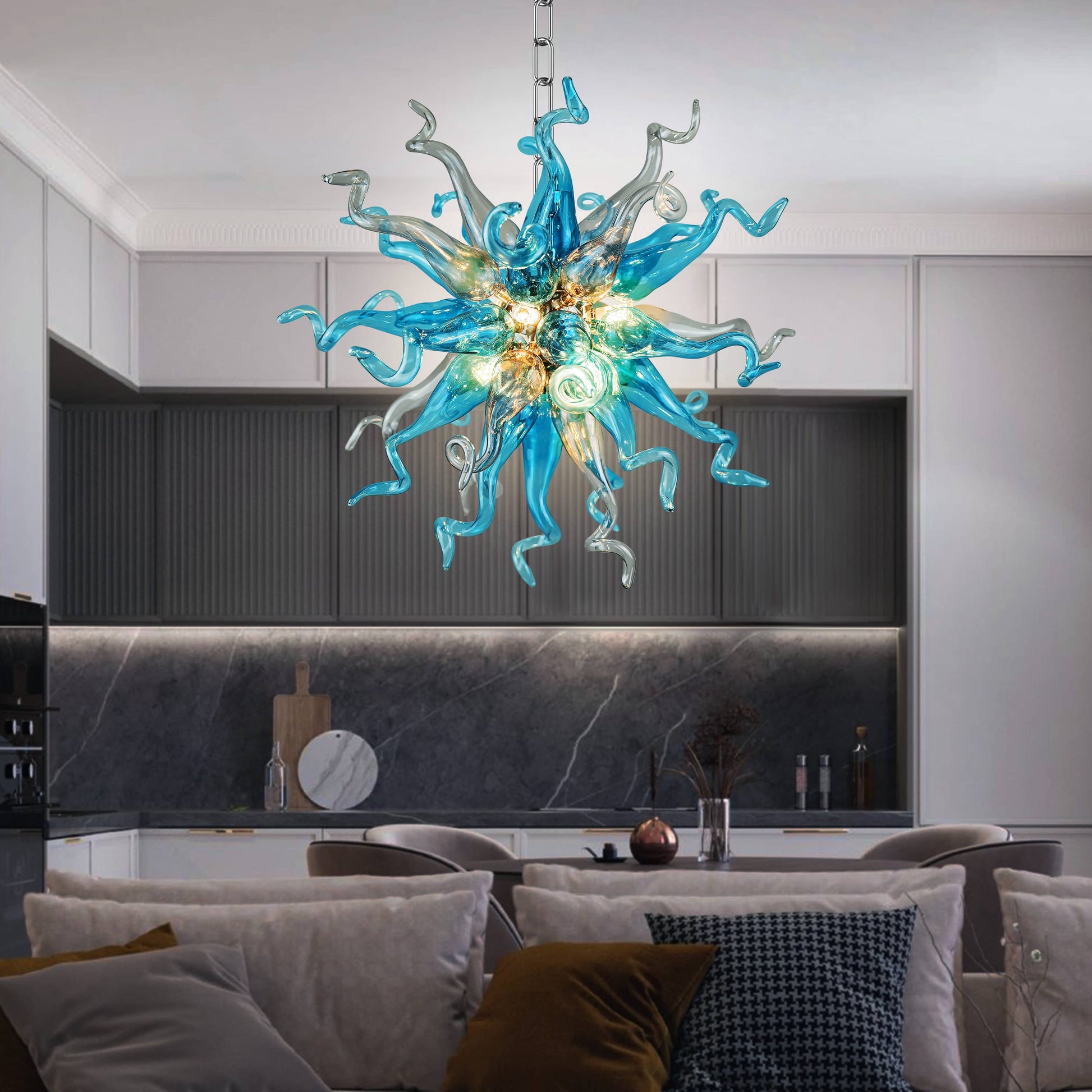 Modern interior with a blue and gray sputnik blown glass chandelier hanging above a dining table.