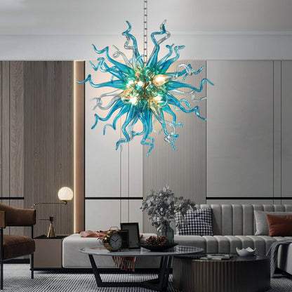 Modern living room with a turquoise blown sputnik glass chandelier, gray sofa, and coffee table.