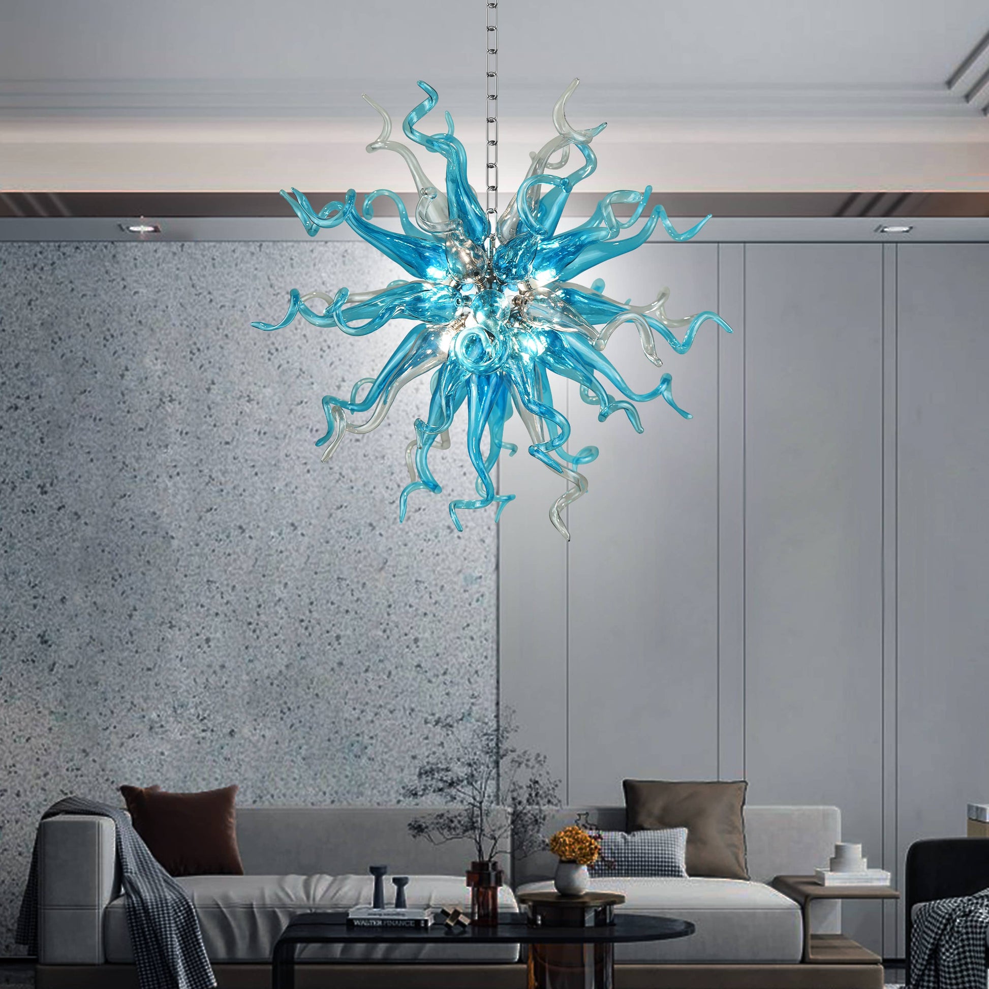 Modern living room with a Chihuly style blue blown glass chandelier in sputinik shape