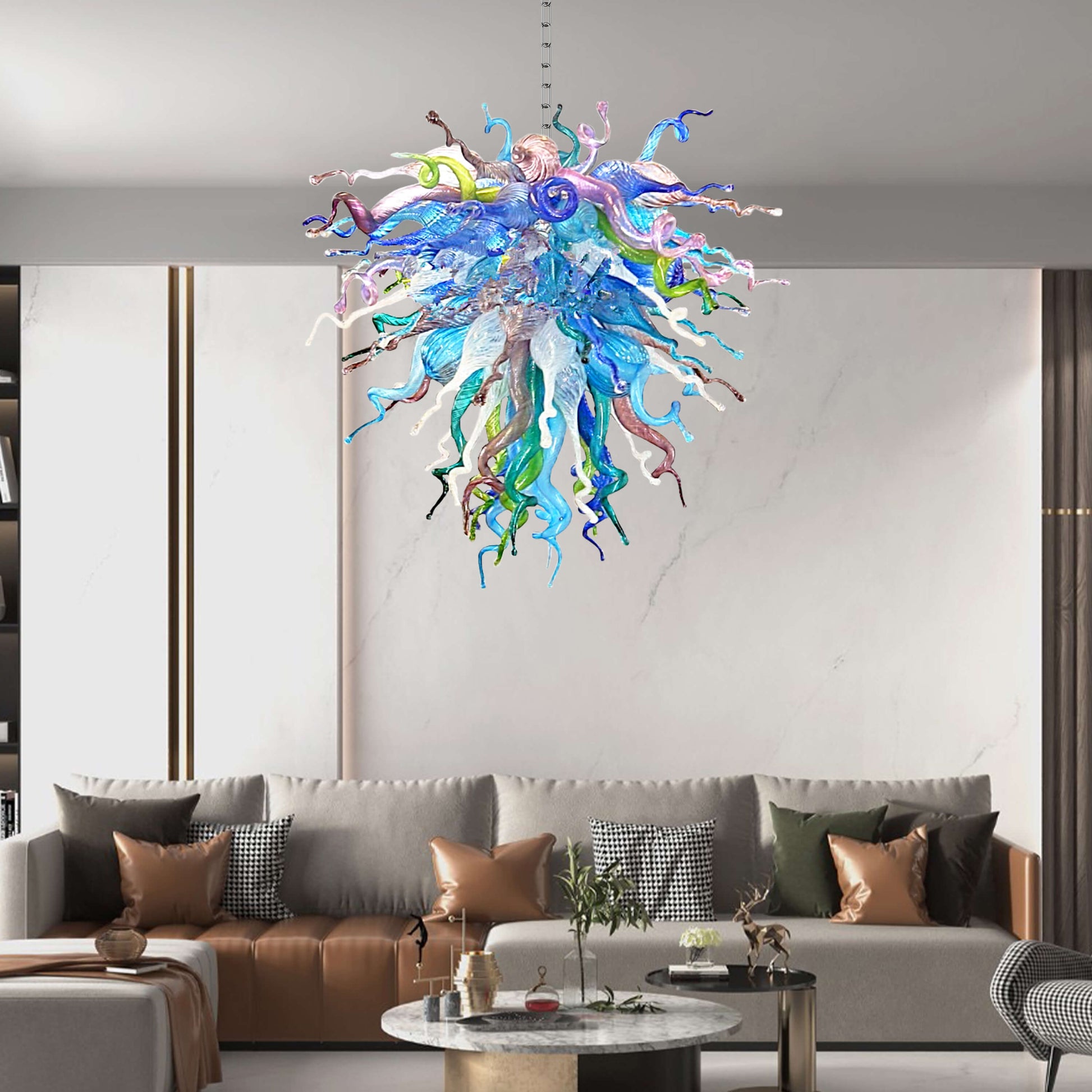 Colorful glass chandelier hanging above a modern living room with a sofa and coffee table.