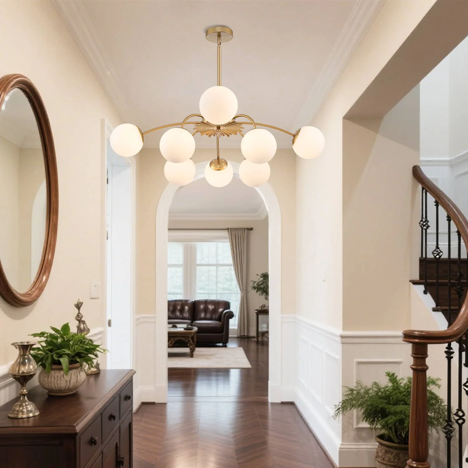 brass globe chandelier in entryway hallway