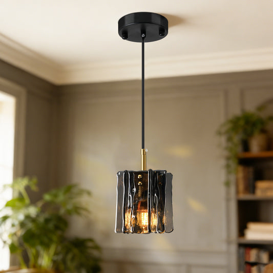 Modern 1-light mini pendant light with smoke gray textured glass in a warm contemporary living space